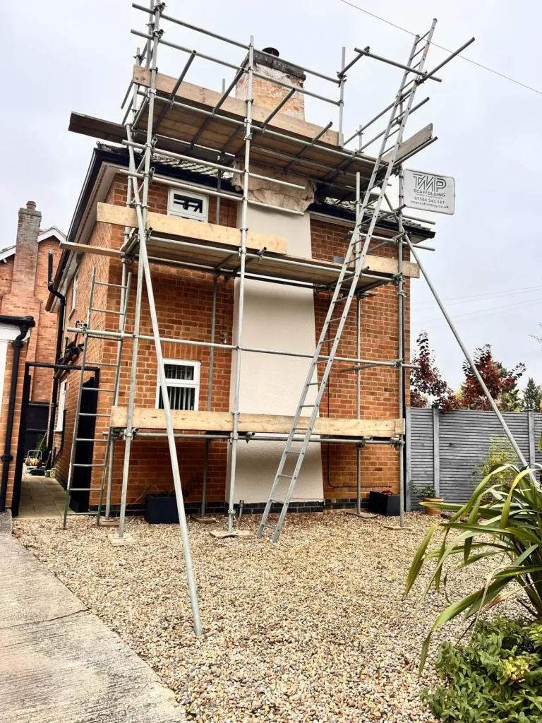 Access scaffolding around a brick house