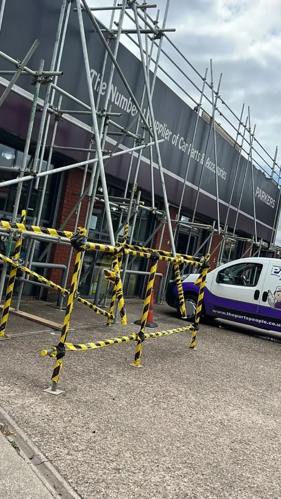 Scaffolding and handrail access around a building