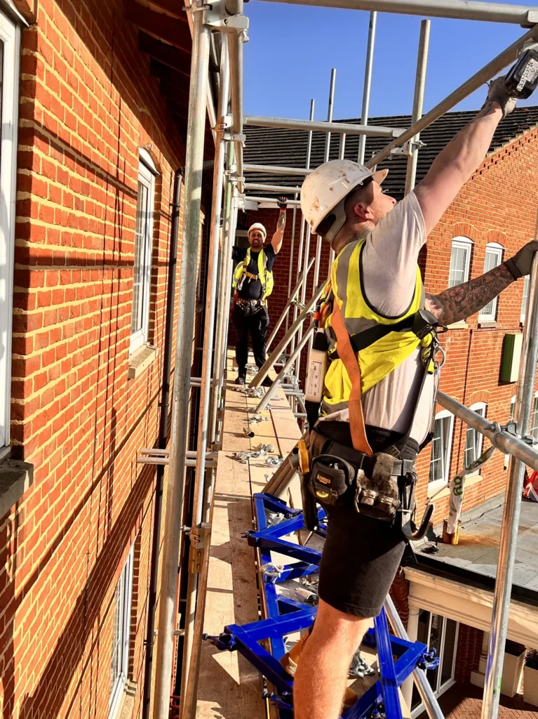 TMP team members working on a scaffold platform