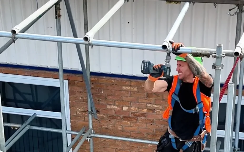 TMP team member assembling scaffolding